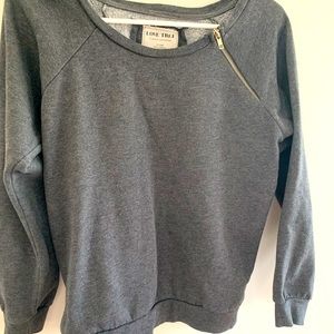 Comfortable and stylish sweatshirt with shoulder zip detail.
